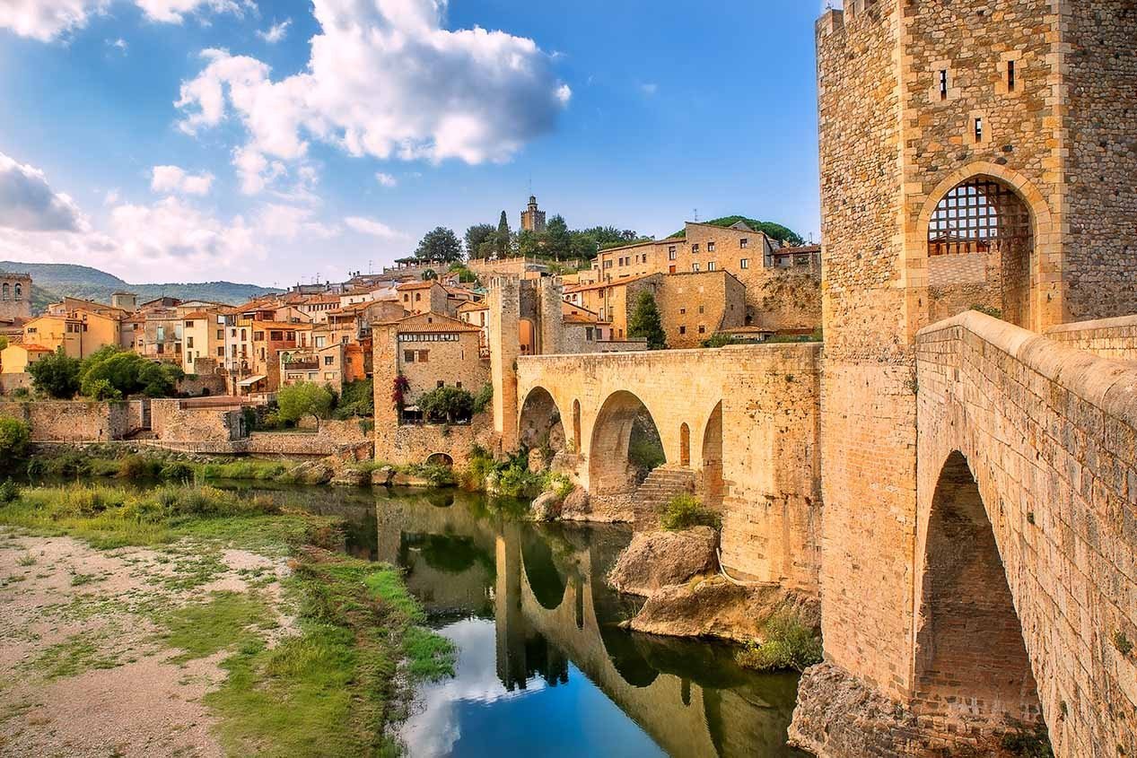 Old medieval Romanesque bridge Besalu over the river Fluvia in Girona.