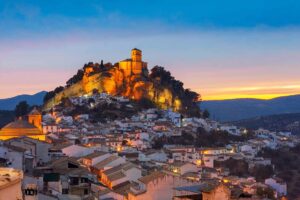 Montefrio in Granada on mountain lit up in the evening,