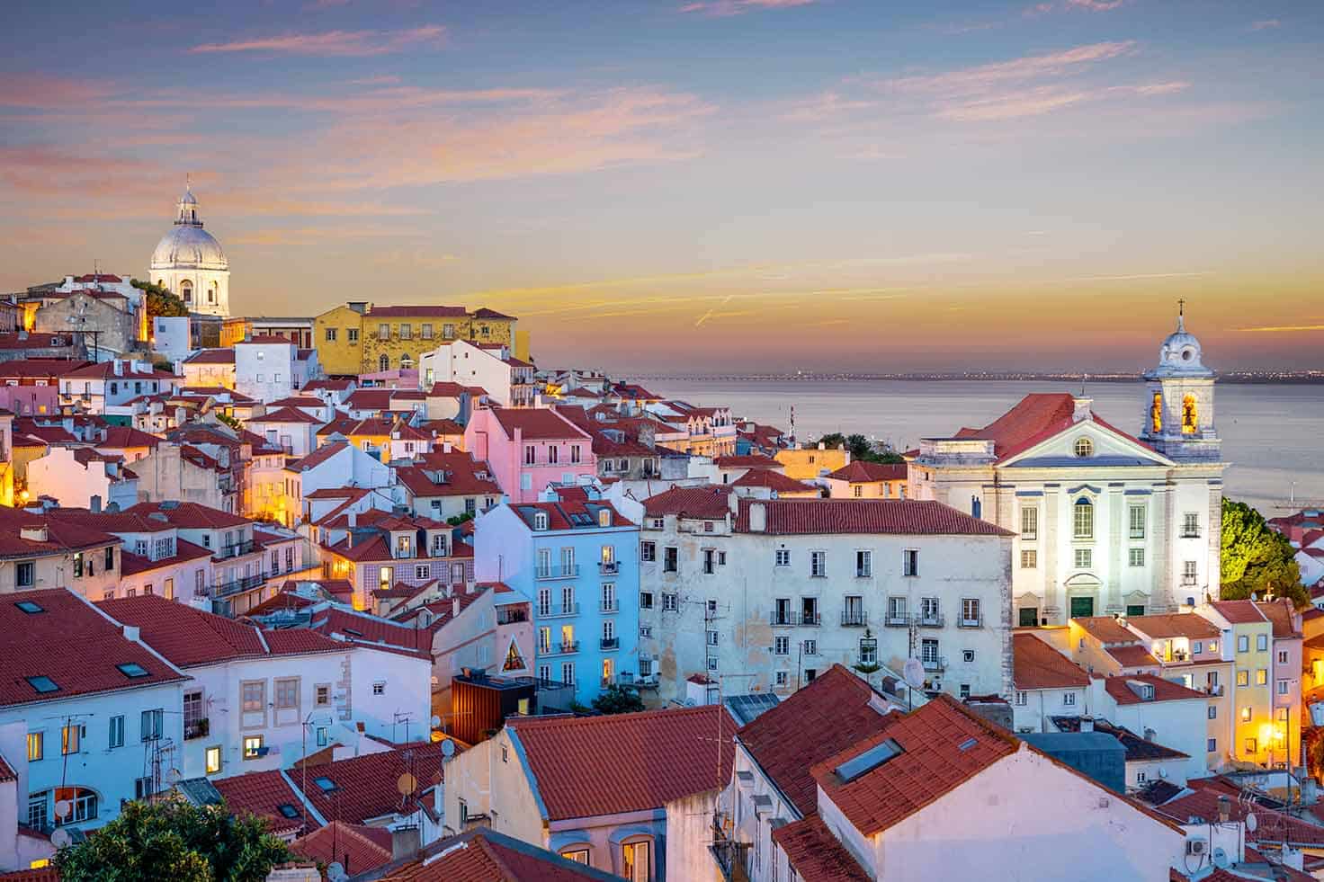 skyline of alfama at lisbon, portugal at dawn