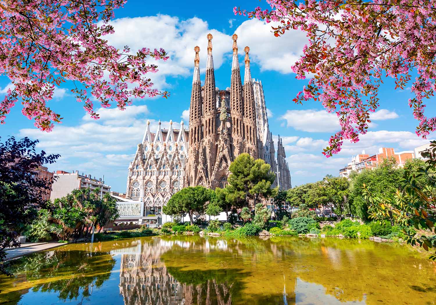 view of sagrada familia from across pond