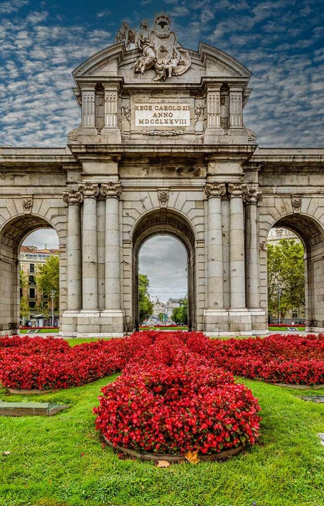 Guests on tour at Puerta de Alcalá monument in the city of Madrid.