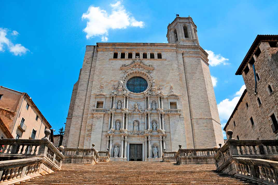 view of front stairs, entrance and facade of Girona cathedral