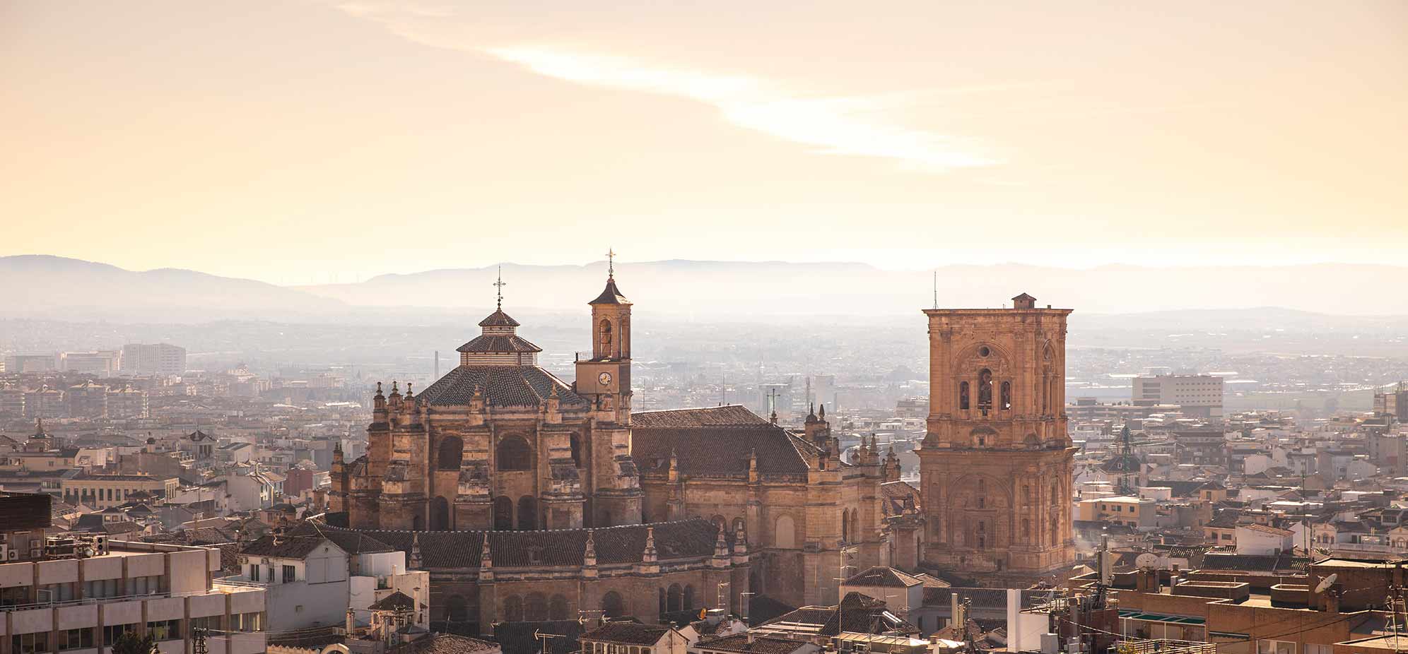 skyline of Granada with granada cathedral prominent in the foreground.