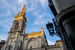 looking up at the spire of the Gothic Cathedral of Santiago in Bilbao.