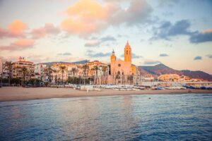 Church of Sant Bartomeu and Santa Tecla in Sitges viewed from the sea.
