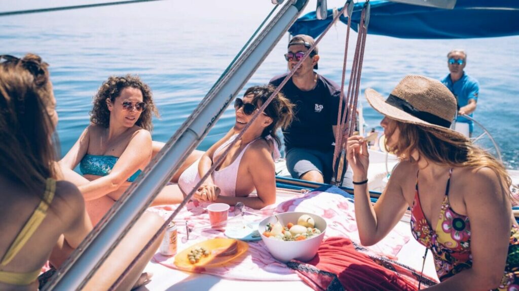 group of young people onboard a private boat with a tour captain